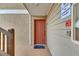 Welcoming orange front door with key features, ensures convenient entry for residents at 9481 Highland Oak Dr # 1511, Tampa, FL 33647