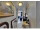 Hallway has decorations and artwork along the white walls and ceramic flooring at 9481 Highland Oak Dr # 1511, Tampa, FL 33647