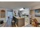 Practical kitchen with bar seating, white cabinetry and access to the rest of the home at 9481 Highland Oak Dr # 1511, Tampa, FL 33647