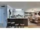Bright kitchen with stainless steel appliances, bar seating, and adjacent dining area at 9481 Highland Oak Dr # 1511, Tampa, FL 33647
