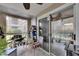 Enclosed patio featuring tile flooring and sliding doors to the exterior at 9481 Highland Oak Dr # 1511, Tampa, FL 33647