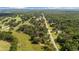 Aerial view showing homes with mature trees and lush surroundings at 9542 Wallien Dr, Brooksville, FL 34601