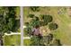 Aerial view of home surrounded by mature trees, showcasing the peaceful neighborhood at 9542 Wallien Dr, Brooksville, FL 34601