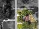 An aerial shot of the property showcasing the house, its location, the surrounding landscape, and backyard at 9542 Wallien Dr, Brooksville, FL 34601