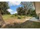 Picturesque backyard features garden beds and an inviting seating area at 9542 Wallien Dr, Brooksville, FL 34601