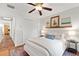 Cozy bedroom with queen bed, plush rug, and bright natural light at 9542 Wallien Dr, Brooksville, FL 34601