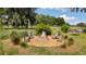 An inviting brick fire pit with Adirondack chairs and a hammock at 9542 Wallien Dr, Brooksville, FL 34601