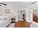 Chic main bedroom featuring hardwood floors and seamless flow to living spaces at 9542 Wallien Dr, Brooksville, FL 34601