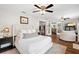 Relaxing main bedroom boasting hardwood floors and access to a cozy sitting area at 9542 Wallien Dr, Brooksville, FL 34601