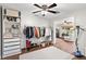 Bright walk-in closet with built-in storage and clothing rack at 9542 Wallien Dr, Brooksville, FL 34601