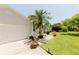 Charming home featuring a well-manicured lawn, lush landscaping, and a welcoming double-door entrance at 3010 Grand View Ave, Clearwater, FL 33759