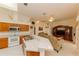 Spacious kitchen features light countertops, white appliances, and an open layout to the living area at 3010 Grand View Ave, Clearwater, FL 33759