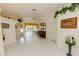 Bright living area features tile flooring, a ceiling fan, and sliding glass doors to let the light shine in at 3010 Grand View Ave, Clearwater, FL 33759