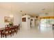 Spacious living room featuring tile flooring and a view to the sun room at 3010 Grand View Ave, Clearwater, FL 33759