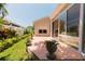 An outdoor patio is surrounded by lush garden landscaping and provides a serene and private setting at 3010 Grand View Ave, Clearwater, FL 33759