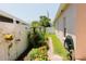 A side yard features an ornate flower garden, and offers a lovely space for outdoor enjoyment at 3010 Grand View Ave, Clearwater, FL 33759