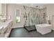 Elegant bathroom featuring a large shower, soaking tub, double sink vanity, and stylish fixtures at 4111 W Swann Ave, Tampa, FL 33609
