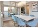 Dining room with seating for eight, large mirror wall, and decorative chandelier at 4111 W Swann Ave, Tampa, FL 33609