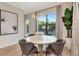 Bright dining room with modern chandelier, backyard views, table and seating for 6 at 4111 W Swann Ave, Tampa, FL 33609
