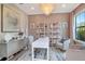 This home office features ample light, modern decor, and spacious furniture at 4111 W Swann Ave, Tampa, FL 33609
