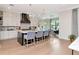 Contemporary kitchen with bar seating, stainless steel appliances, and hardwood floors at 4111 W Swann Ave, Tampa, FL 33609