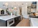 Spacious kitchen features an island with bar seating, stainless steel appliances, and ample cabinets at 4111 W Swann Ave, Tampa, FL 33609