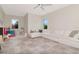 Spacious living area offering a generous white couch, large windows, and neutral decor at 4111 W Swann Ave, Tampa, FL 33609