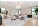 Spacious main bedroom features a sitting area, modern lighting, and neutral decor at 4111 W Swann Ave, Tampa, FL 33609