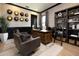 Stylish office with a textured wall, comfortable seating, and black trim throughout at 4111 W Swann Ave, Tampa, FL 33609