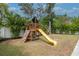 Backyard playset features a slide and swing set for Gathering fun at 4111 W Swann Ave, Tampa, FL 33609