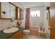 Bathroom featuring a coordinated color scheme, a vanity with a sink, and a shower with a curtain at 10031 Cherry Creek Ln, Port Richey, FL 34668