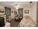 Inviting bedroom with patterned curtains, wood floors, and a comfortable twin bed, creating a relaxing space at 10031 Cherry Creek Ln, Port Richey, FL 34668