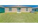The backyard has a lush lawn and a covered patio area for outdoor relaxation at 10245 Shady Preserve Dr, Riverview, FL 33578