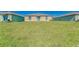 Backyard features well-maintained grass and the rear of the house at 10245 Shady Preserve Dr, Riverview, FL 33578