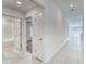 Bright hallway with ceramic tile leading to bedrooms and living areas at 10245 Shady Preserve Dr, Riverview, FL 33578