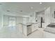 Open concept kitchen with stainless steel appliances and center island at 10245 Shady Preserve Dr, Riverview, FL 33578