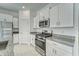 Modern kitchen featuring stainless steel appliances and granite countertops at 10245 Shady Preserve Dr, Riverview, FL 33578
