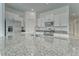 Granite kitchen island with stainless steel sink and faucet, with appliances nearby at 10245 Shady Preserve Dr, Riverview, FL 33578