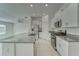 Bright kitchen with white cabinets, granite countertops, and stainless steel appliances at 10245 Shady Preserve Dr, Riverview, FL 33578