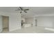 Open floor plan showcasing the kitchen island and white tile floors at 10245 Shady Preserve Dr, Riverview, FL 33578