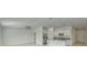Open-concept kitchen and living room with tile flooring and lots of natural light at 10245 Shady Preserve Dr, Riverview, FL 33578