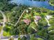 Large lot with mature trees and lake views showcasing the property's boundaries at 10504 Echo Lake Dr, Odessa, FL 33556