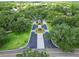 Beautiful aerial view of the neighborhood entrance with immaculate landscaping and street design at 10504 Echo Lake Dr, Odessa, FL 33556