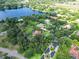 Beautiful aerial view of the property with lake view and other luxurious homes at 10504 Echo Lake Dr, Odessa, FL 33556