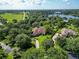 Beautifully landscaped homes in a lush, green community with a lake view at 10504 Echo Lake Dr, Odessa, FL 33556