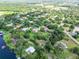 A neighborhood with homes nestled amongst lush foliage and lake at 10504 Echo Lake Dr, Odessa, FL 33556