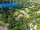 Beautiful aerial view of the property with lake view and other luxurious homes at 10504 Echo Lake Dr, Odessa, FL 33556