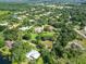An aerial view of a neighborhood with a mix of modern homes and lush greenery at 10504 Echo Lake Dr, Odessa, FL 33556