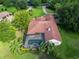 Stunning aerial view of the home with a private screened-in pool surrounded by lush landscaping at 10504 Echo Lake Dr, Odessa, FL 33556