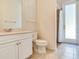 Bathroom featuring a vanity, toilet, tiled floors, and a walk-in shower at 10504 Echo Lake Dr, Odessa, FL 33556